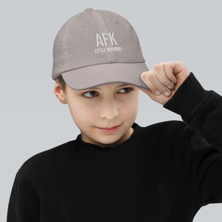 AFK Youth baseball cap worn by child, showcasing stylish design and comfort for outdoor activities.