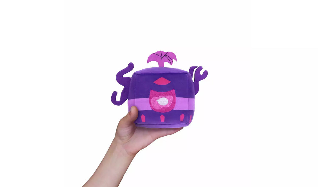 Blox Fruits Series 3 4" Collectable Plush in hand, featuring vibrant purple and pink design with fun details.