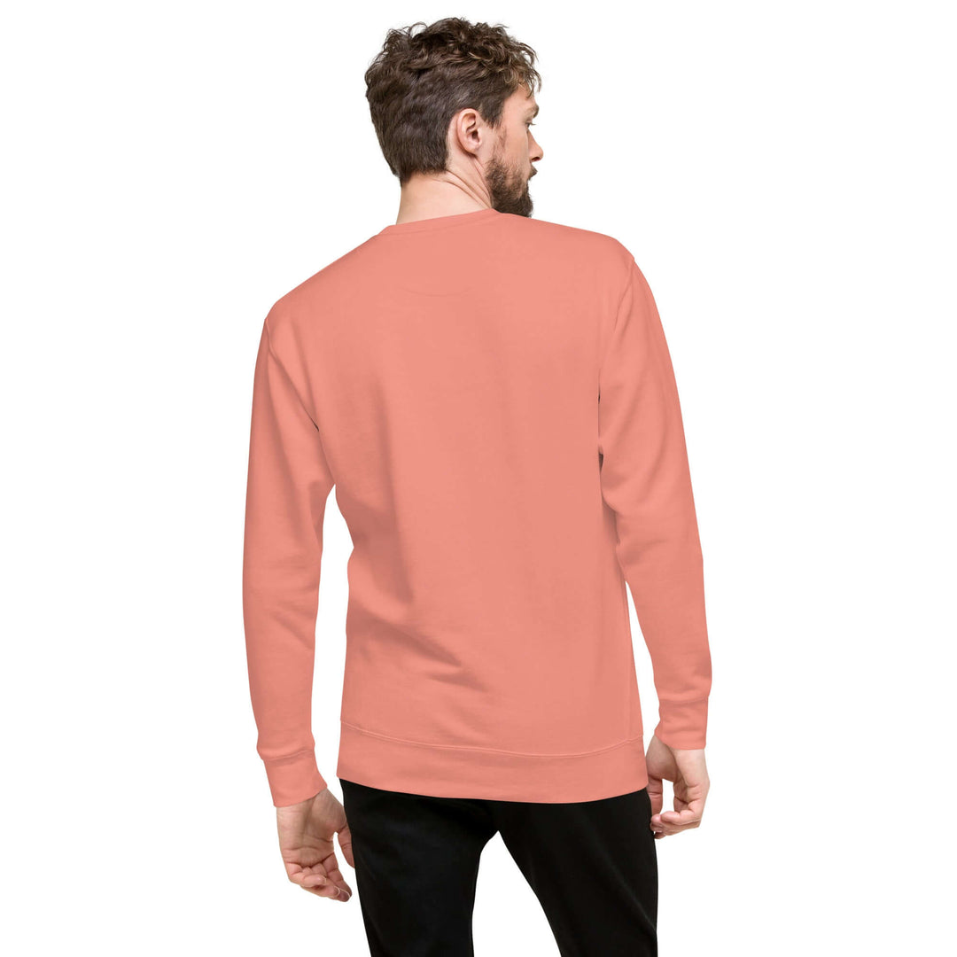 Back view of a person wearing the Earthlets Unisex Premium Sweatshirt in peach color.