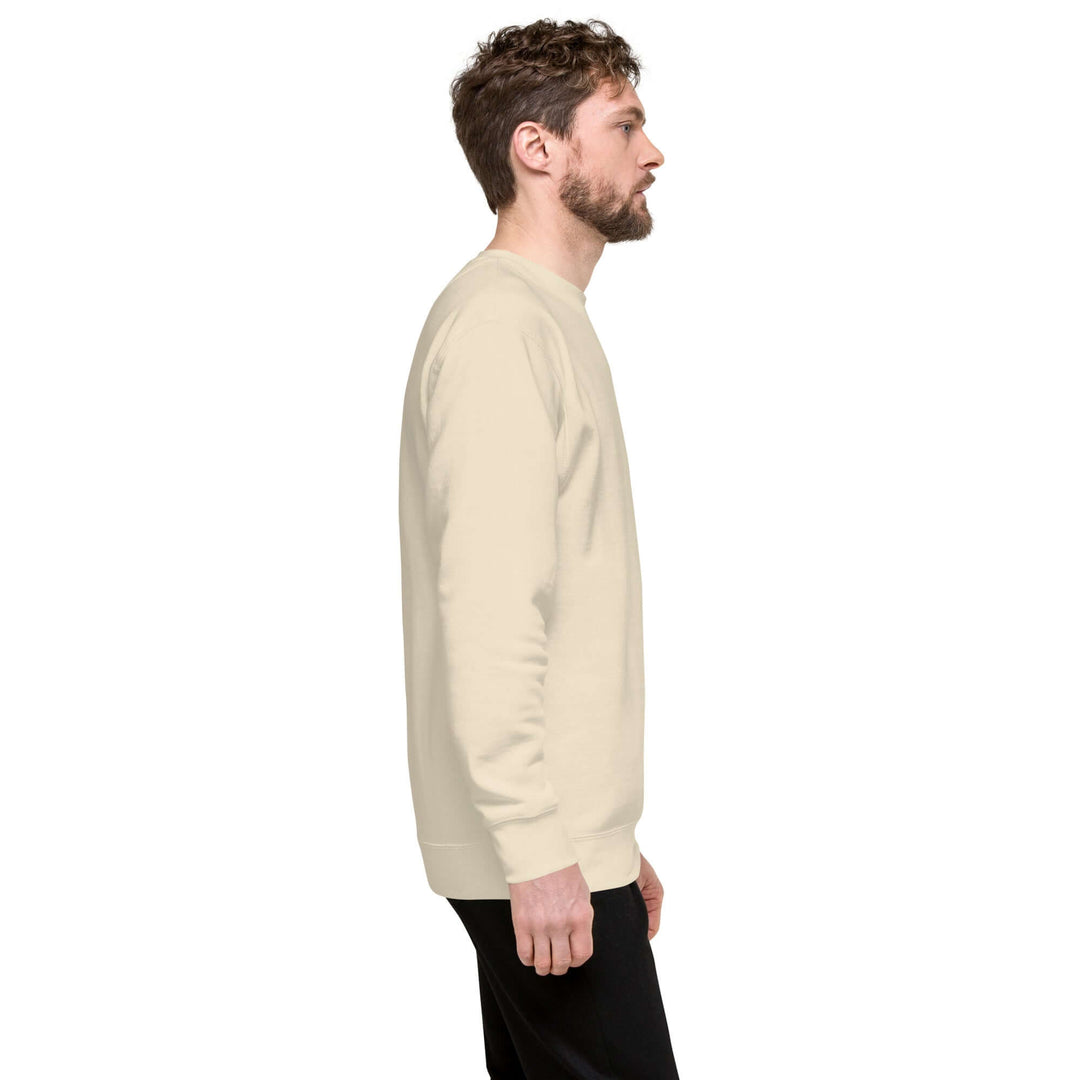 Earthlets Unisex Premium Sweatshirt in beige on a model from the side, showcasing modern streetwear style.