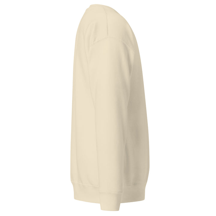 Side view of Earthlets unisex premium sweatshirt in cream color showcasing classic silhouette and ribbed cuffs.