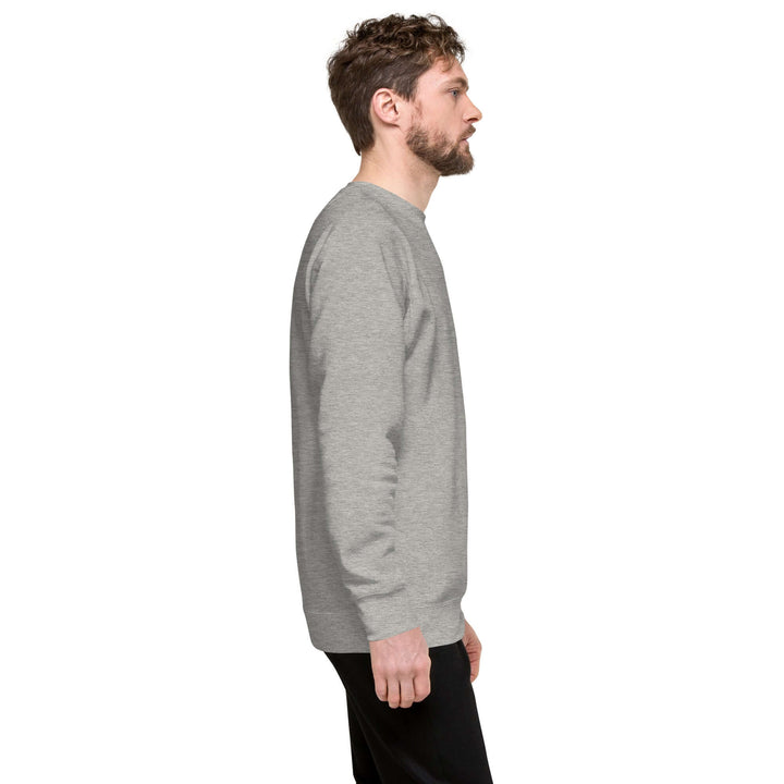 Side view of man wearing Earthlets Unisex Premium Sweatshirt in grey, showcasing its comfortable fit and classic style.