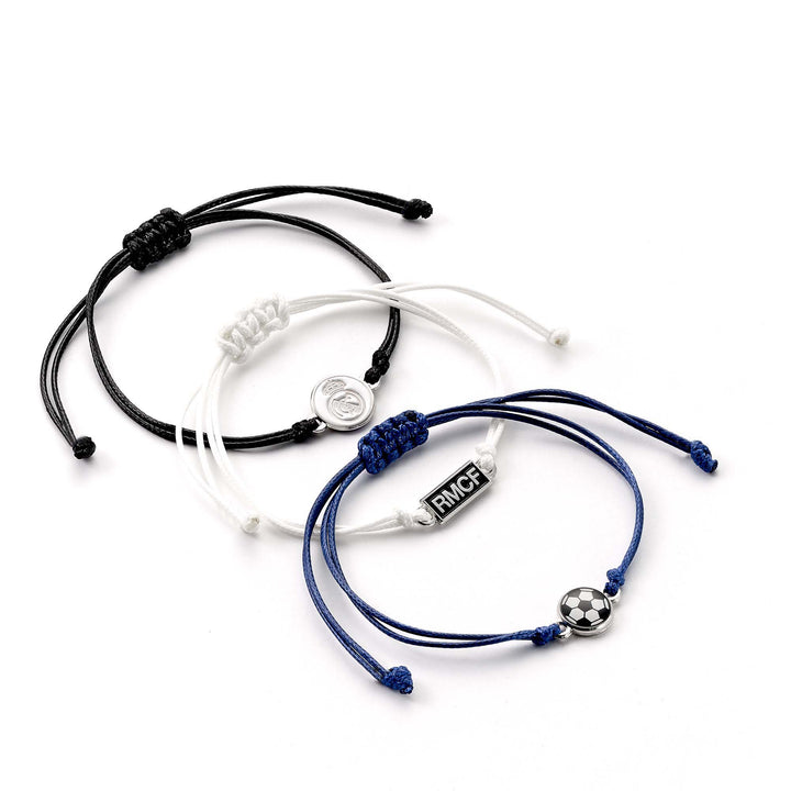 Real Madrid friendship bracelet set featuring black, white, and blue adjustable cords with football charms.