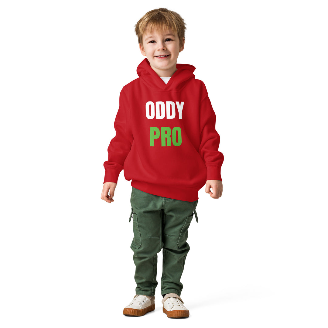 Oddy Pro Toddler fleece pullover hoodie worn by a smiling boy in a red hoodie and green pants.